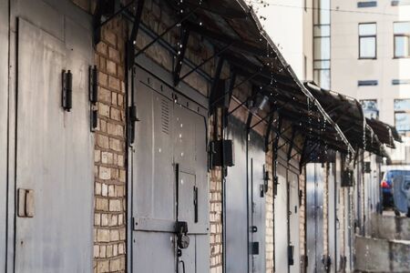 a roof over their iron doors dripping drop.の写真素材