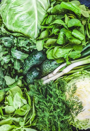 Background of a lot of fresh green different vegetables and herbs, top view, close-up. The concept of healthy, proper nutrition, diet, detox, cleansing.の写真素材