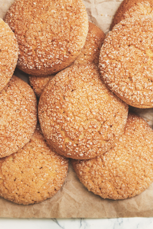 sand round cookies, top view, close-up. Empty place for records. In retro, old style.