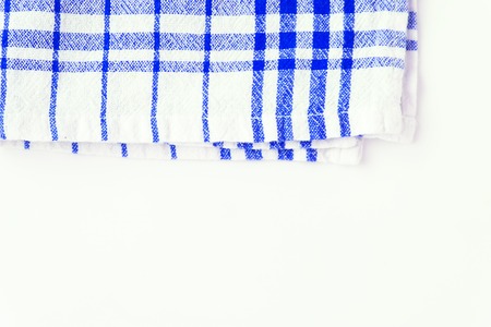 Blue cloth, a kitchen towel with a checkered pattern, on a white background isolated.の写真素材