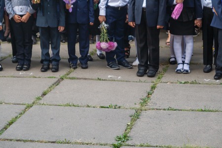 Ukraine.Kiev - September 1, 2016. First-graders and other students on the line near the school.のeditorial素材