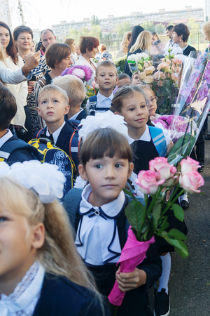 Ukraine.Kiev - September 1, 2016. First-graders and other students on the line near the school.のeditorial素材