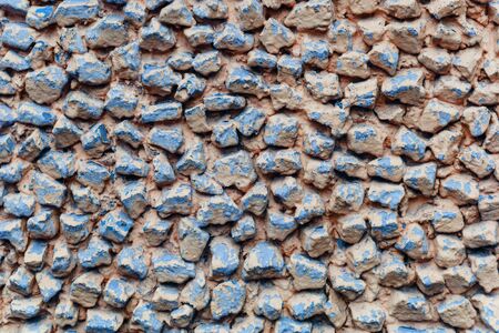 background old broken brown-yellow brick wall.の写真素材