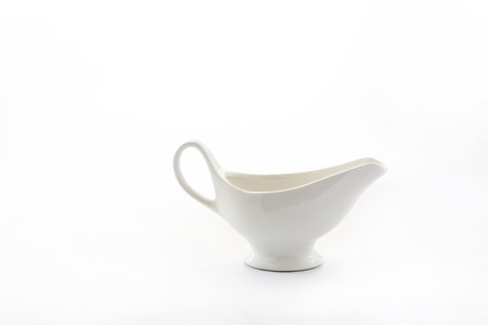 white porcelain sauceboat cup isolated on white background.の写真素材
