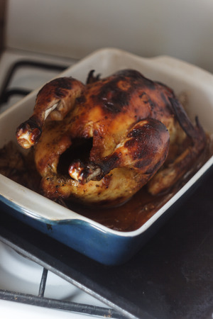 appetizing baked chicken with golden roasted crust cooked in the oven.の写真素材
