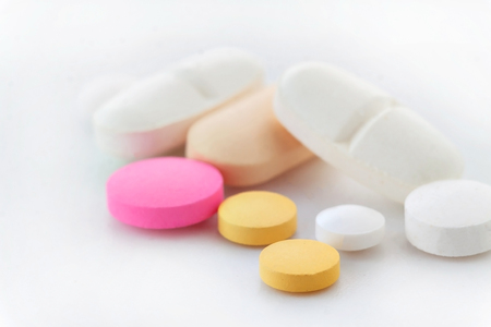 Heap of medicine pills.  Background from colorful pills and capsules.の写真素材