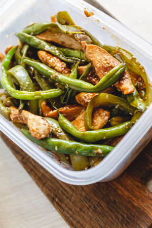 Chicken stew and green beans in plastic ovensの写真素材
