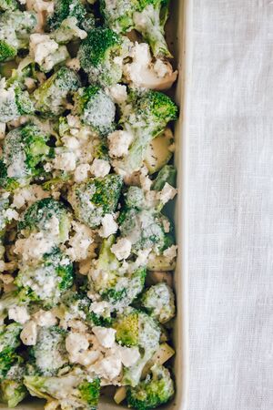 Chicken fillet and broccoli baked in cheese sauce in a baking di. Chicken fillet and broccoli baked in cheese sauce close-up in a baking dish. horizontal.の写真素材
