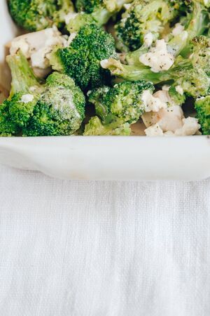 Chicken fillet and broccoli baked in cheese sauce in a baking di. Chicken fillet and broccoli baked...