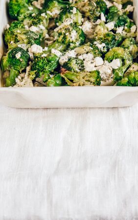 Chicken fillet and broccoli baked in cheese sauce in a baking di. Chicken fillet and broccoli baked in cheese sauce close-up in a baking dish. horizontal.の写真素材