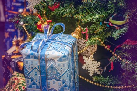 A variety of wrapped gifts under a festively decorated Christmas tree. Life style.の写真素材