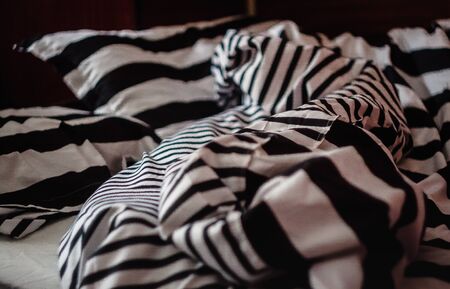 not the laid bed with a pattern of black-and-white strip, close-upの写真素材