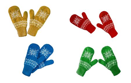 pair of red-blue-green-yellow knitted mittens with christmas pattern isolated on white background. Collage of different mittens.の写真素材