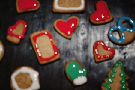 Christmas gingerbread with christmas decorations on dark stone background. Christmas baking background. Top view with copy spaceの写真素材