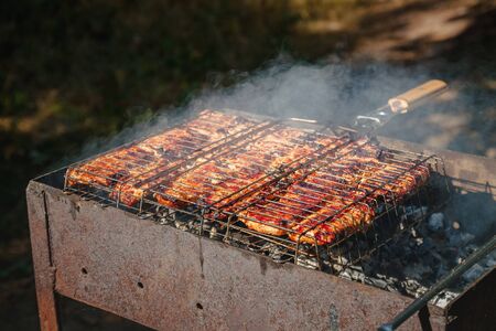 Meat-kebab on skewers and grill grate. Top view, close-up.の写真素材