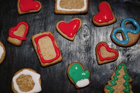 Christmas gingerbread with christmas decorations on dark stone background. Christmas baking background. Top view with copy spaceの写真素材