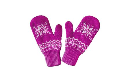 pair of pink lilac purple knitted mittens with christmas pattern isolated on white background. Collage of different mittens.の写真素材
