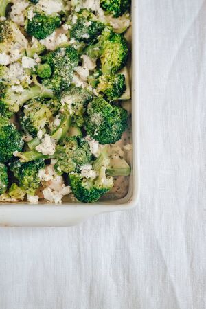 Chicken fillet and broccoli baked in cheese sauce in a baking di. Chicken fillet and broccoli baked in cheese sauce close-up in a baking dish. horizontal.の写真素材