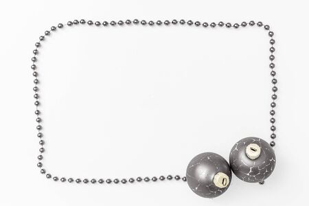 Christmas holidays composition, top view silver gray christmas decorations on white background with copy space for text. Flat lay. Winter, postcard template.の写真素材
