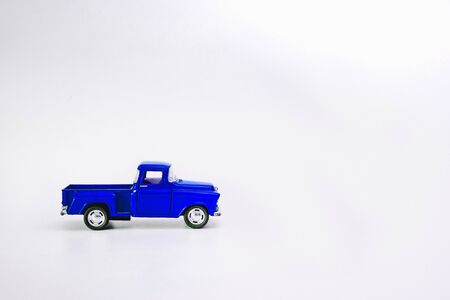 Blue retro car pickup on a white isolated background with copy spaceの写真素材