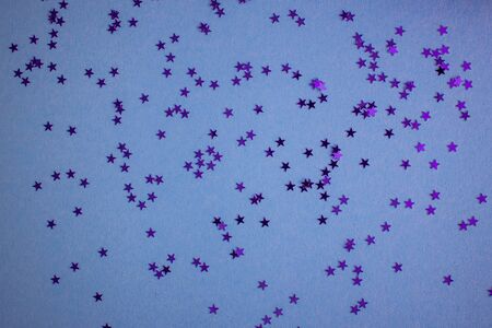 Blue-green-aquamarine background with festive shiny stars. Copy space. Postcard templateの写真素材