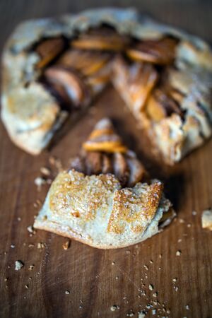 apple galette - pie on white baking parchment. Copy space, flat lay.の写真素材