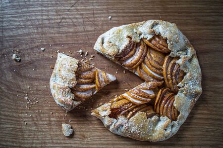 apple galette - pie on white baking parchment. Copy space, flat lay.の写真素材