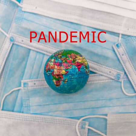 world earth and masks to combat the corona virus with red text PANDEMIC CORONOVIRUS COVID 19 nCoV...