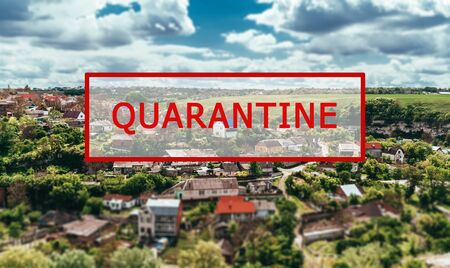 Crisis in the tourism industry due to outbreaks of coronavirus. Stopped traveling, red text QUARANTINE against the blue sky of the city, town. Kamyanets-Podilsky, Zalishchyky, Ukraineの写真素材