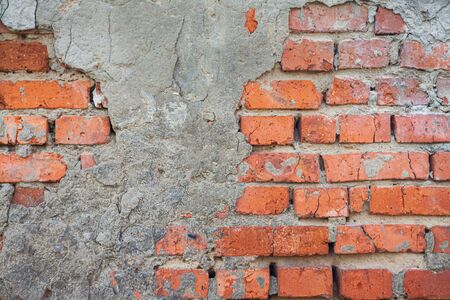 background from the texture of an old brick wall with ruined concrete
