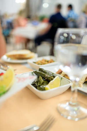 Traditional Turkish dish Yaprak sarm - rice in grape leaves. Serving in a Turkish restaurantの写真素材