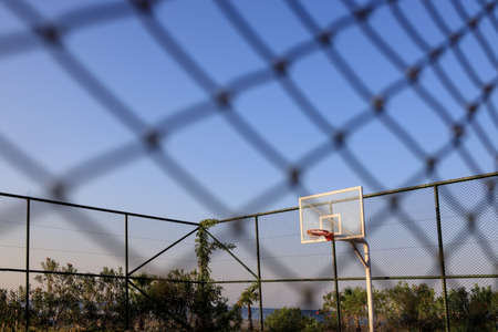 view through the net to the basketball court on a clear sunny day in the resort of Alanya, Turkeyの写真素材
