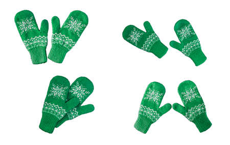 pair of green knitted mittens with christmas pattern isolated on white background. Collage of different mittens.の写真素材
