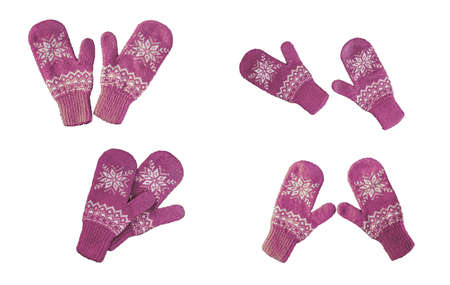 pair of pink lilac purple knitted mittens with christmas pattern isolated on white background. Collage of different mittens.の写真素材