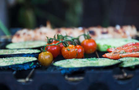 on the grill rack, a variety of vegetables are prepared.の写真素材