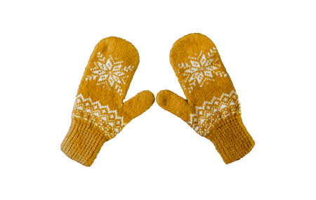 pair of yellow orange knitted mittens with christmas pattern isolated on white background. Collage of different mittens.の写真素材