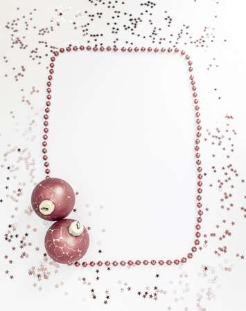 Christmas holidays composition, top view pink-purple-violet Christmas decorations on white-blue background with copy space for text. Flat lay. Winter, postcard template.の写真素材