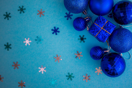 Christmas holidays composition, top view blue-aquamarine Christmas decorations on a green-blue background with copy space for text. Flat lay. Winter, postcard template.の写真素材