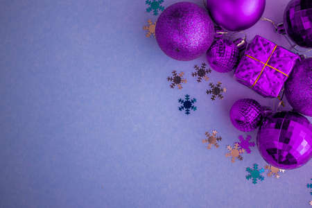 Christmas holidays composition, top view pink-purple-violet Christmas decorations on white-blue background with copy space for text. Flat lay. Winter, postcard template.の写真素材