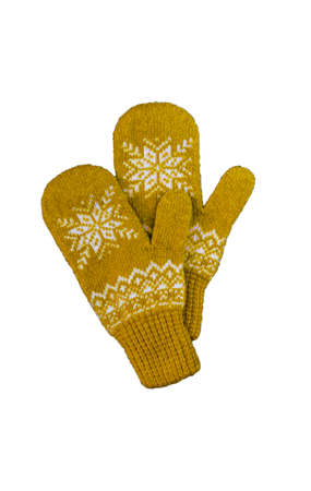 pair of yellow orange knitted mittens with christmas pattern isolated on white background. Collage of different mittens.の写真素材
