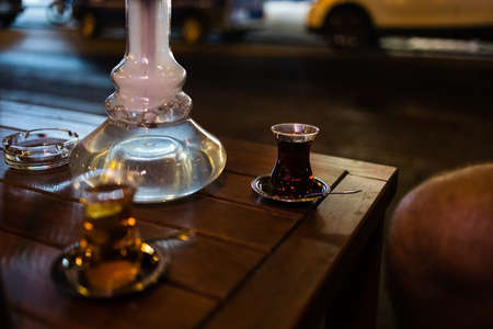 traditional Turkish apple tea and hookah in a hookah bar in Turkey.