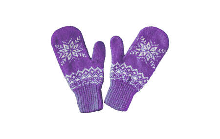 pair of pink lilac purple knitted mittens with christmas pattern isolated on white background. Collage of different mittens.の写真素材