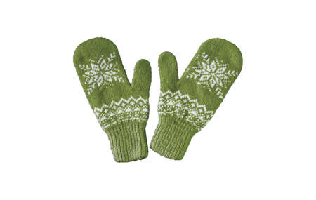 pair of green knitted mittens with christmas pattern isolated onの写真素材