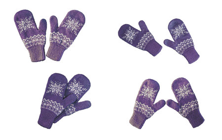 pair of pink lilac purple knitted mittens with christmas pattern isolated onの写真素材