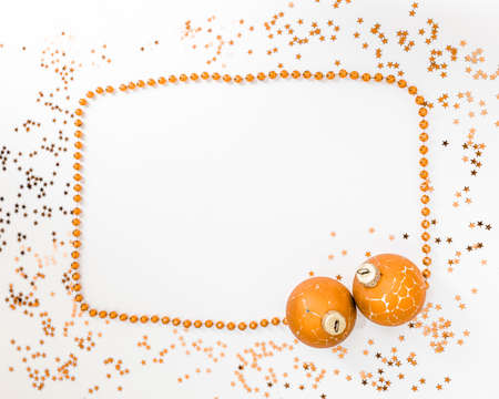 Christmas holidays composition, top view of gold Christmas decorations and garland with lights on a yellow background with copy space for text. Blur. Flat lay. Winter, postcard templateの写真素材