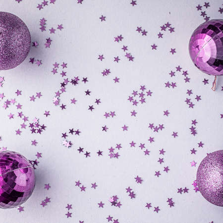 Christmas holidays composition, top view pink-purple-violet Christmas decorations on white-blue background with copy space for text. Flat lay. Winter, postcard templateの写真素材
