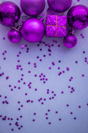 Christmas holidays composition, top view pink-purple-violet Christmas decorations on white-blue background with copy space for text. Flat lay. Winter, postcard templateの写真素材