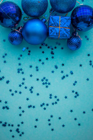Christmas holidays composition, top view blue-aquamarine Christmas decorations on a green-blue background with copy space for text. Flat lay. Winter, postcard templateの写真素材