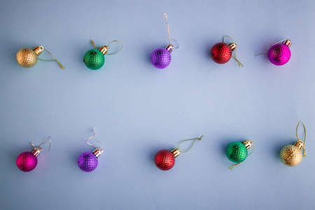 Christmas holidays composition, top view colored Christmas decorations on a purple-lilac background with copy space for text. Flat lay. Winter, postcard templateの写真素材