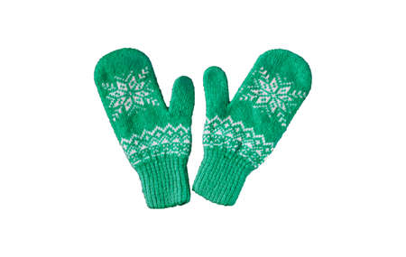 pair of green knitted mittens with christmas pattern isolated onの写真素材